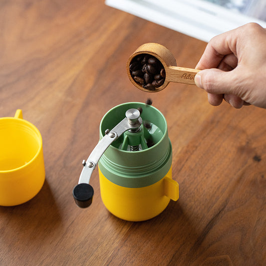 All-in-one hand grinding coffee pot with integrated grinder for pour-over