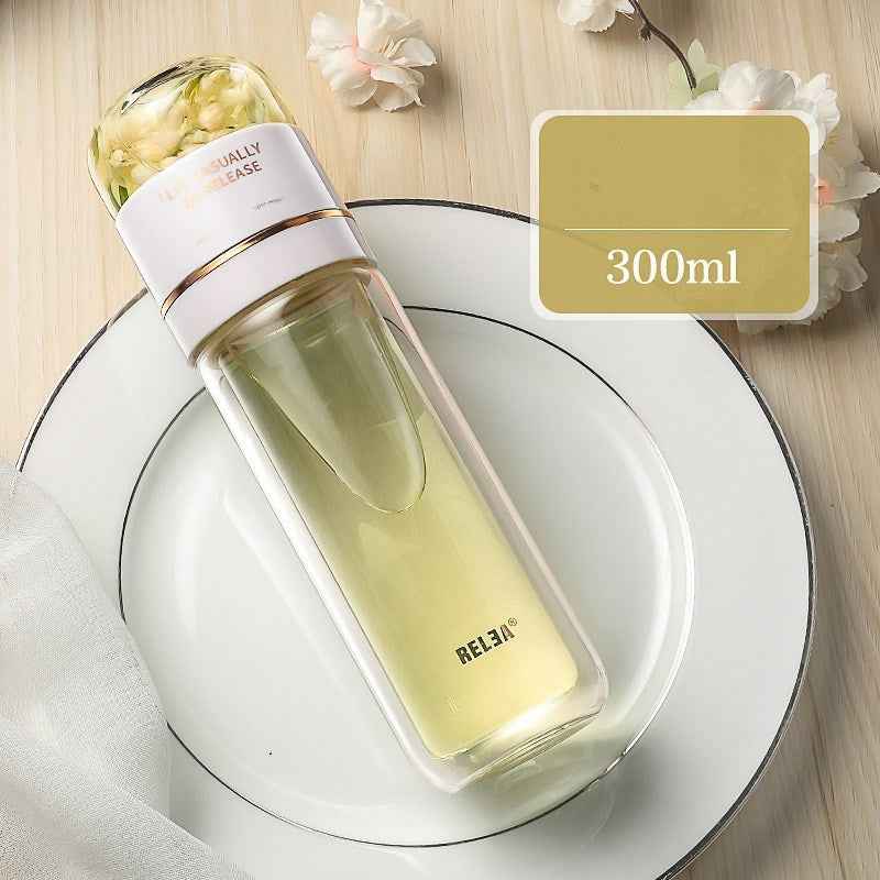 Glass tumbler with straw carried in car cup holder or backpack, perfect for commute and travel