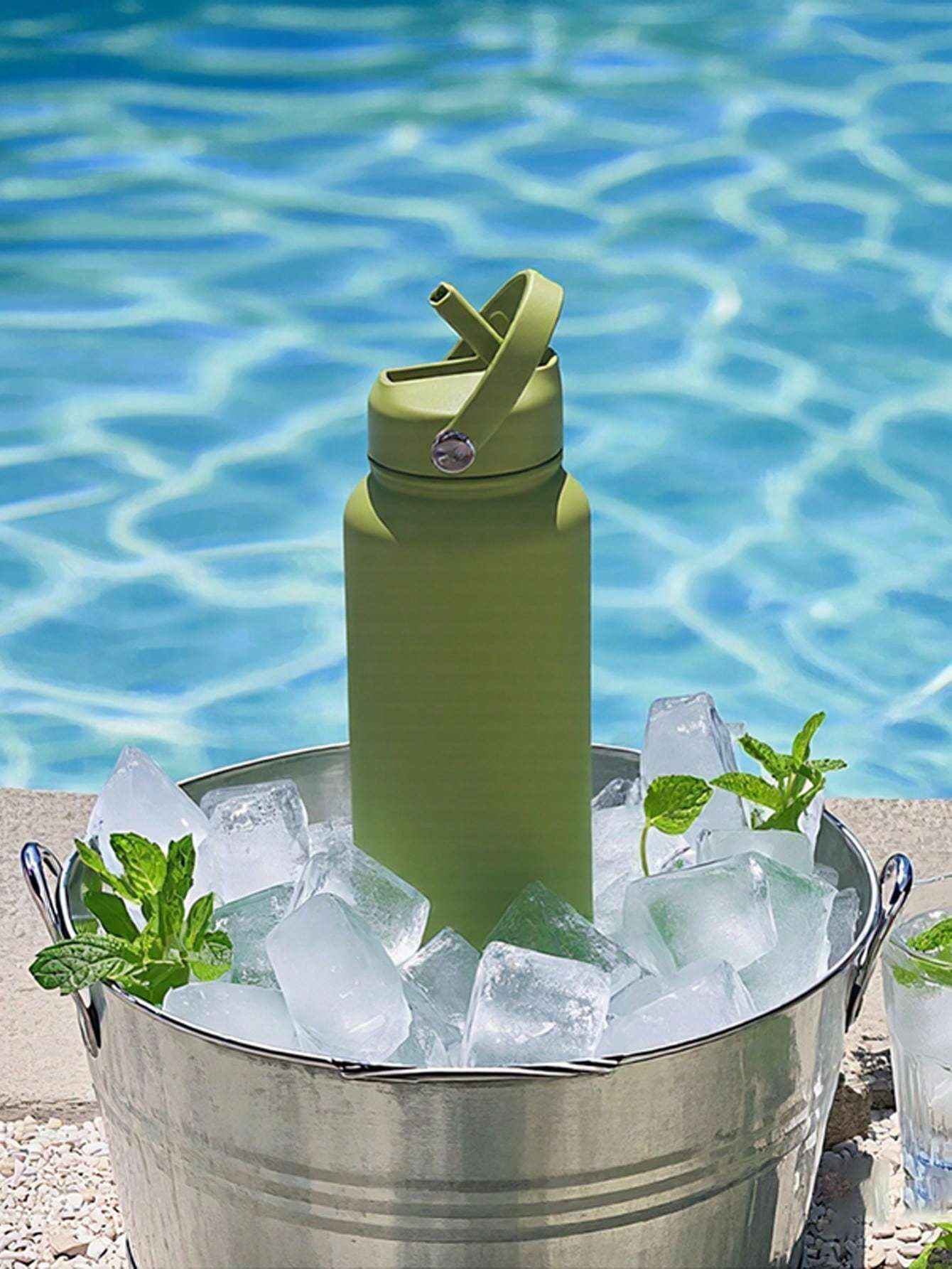 One-click push-button straw lid on insulated water bottle for easy hands-free hydration during workouts