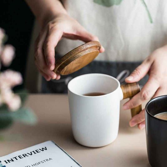 “Handcrafted stoneware coffee mug with acacia wood handle – perfect coffee cup for daily use”