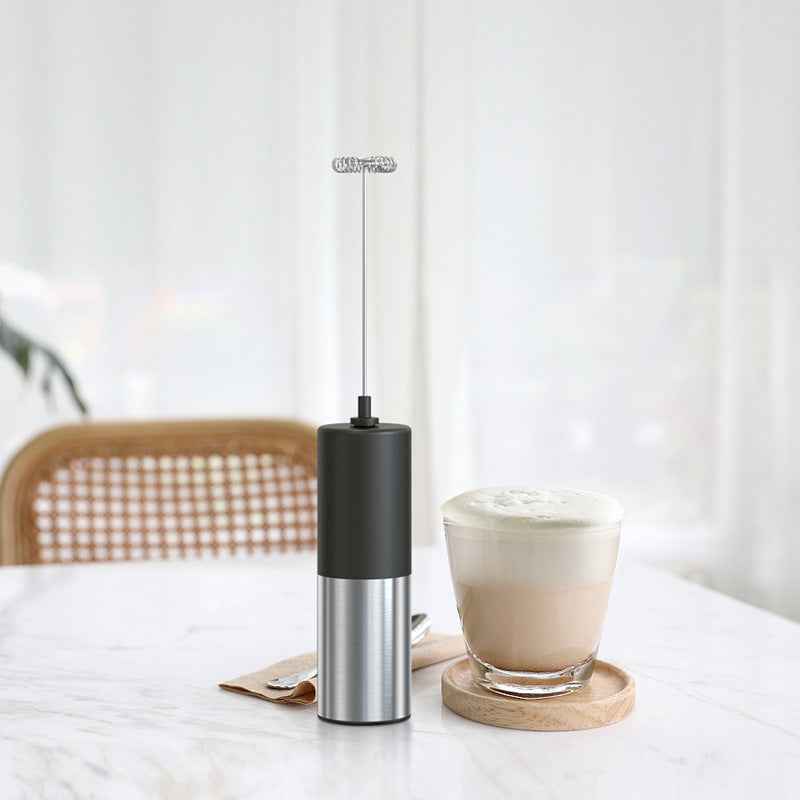Milk frother creating velvety foam - Perfect for lattes, cappuccinos, and hot chocolate - Easy one-button operation for perfect results