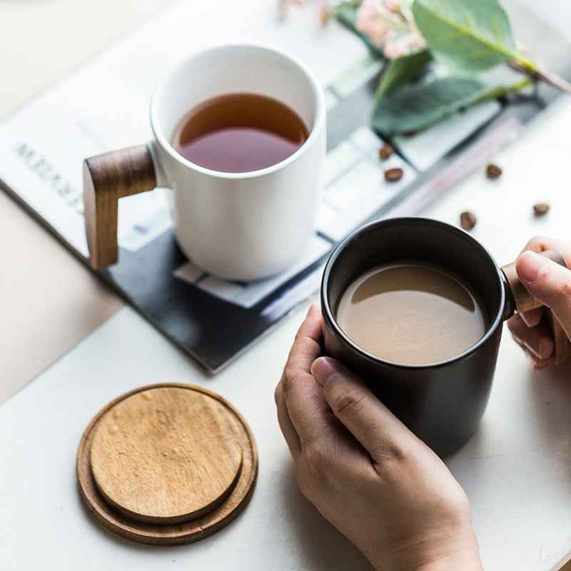 “Elegant ceramic coffee cup – unique acacia wood handle for hot beverages at home or office”
