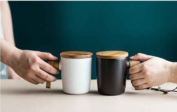 “Handmade ceramic coffee cup with wooden handle – perfect gift for coffee enthusiasts”