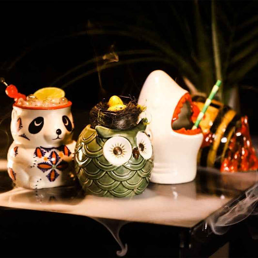 Handcrafted Tiki mug with detailed Polynesian-inspired facial design for tropical cocktails