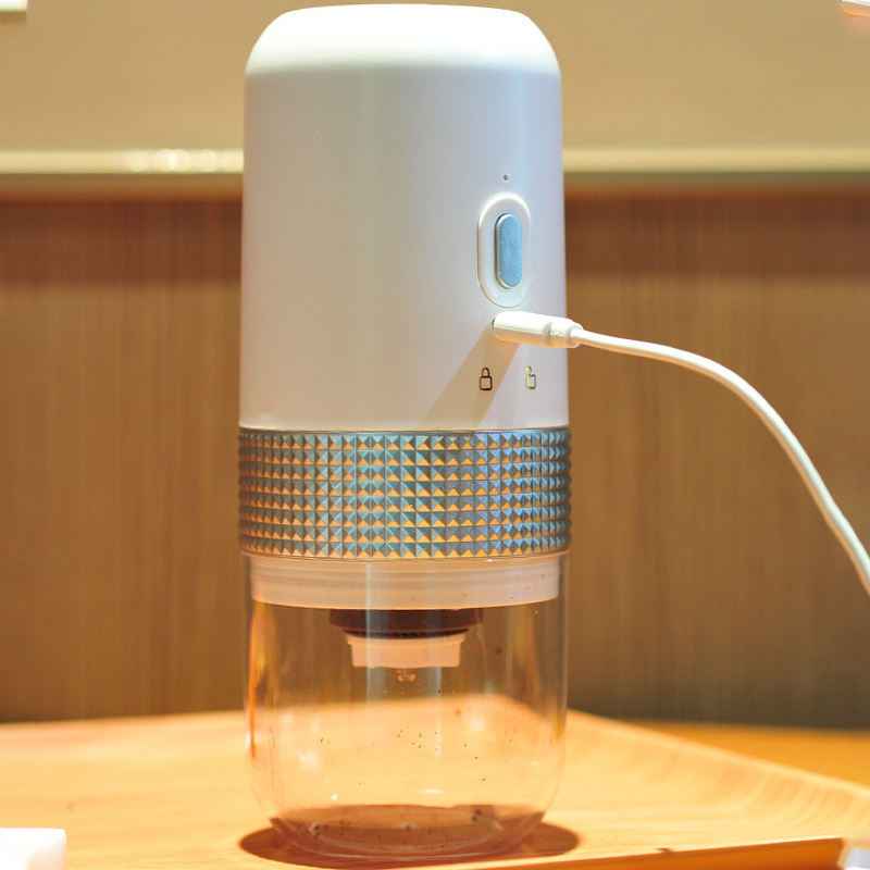 Portable grinder in backpack side pocket - Ultimate travel companion for coffee lovers - Never settle for pre-ground coffee again