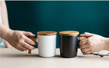 “Handmade ceramic coffee cup with wooden handle – perfect gift for coffee enthusiasts”